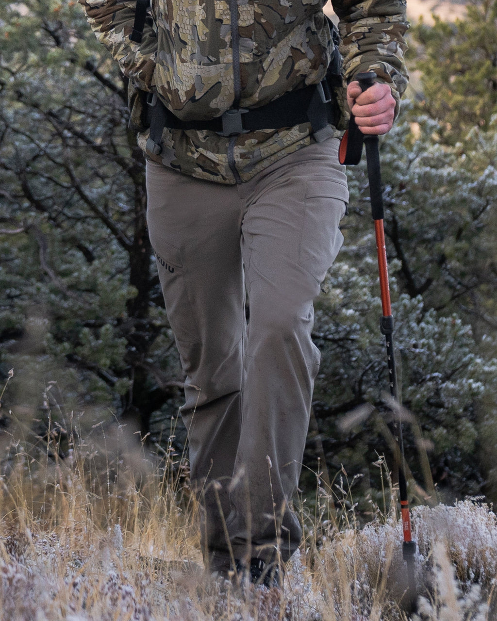 Front of Hunter Hiking Wearing Attack Pants in Khaki Color