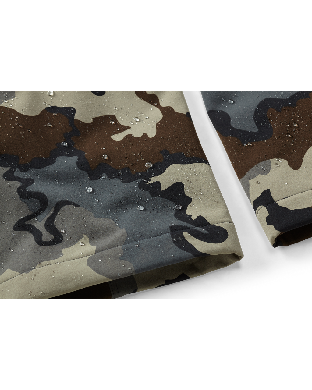 Zoomed in detail Talus Hybrid Pant in Vias Camouflage showcasing water droplets on the ankle cuff