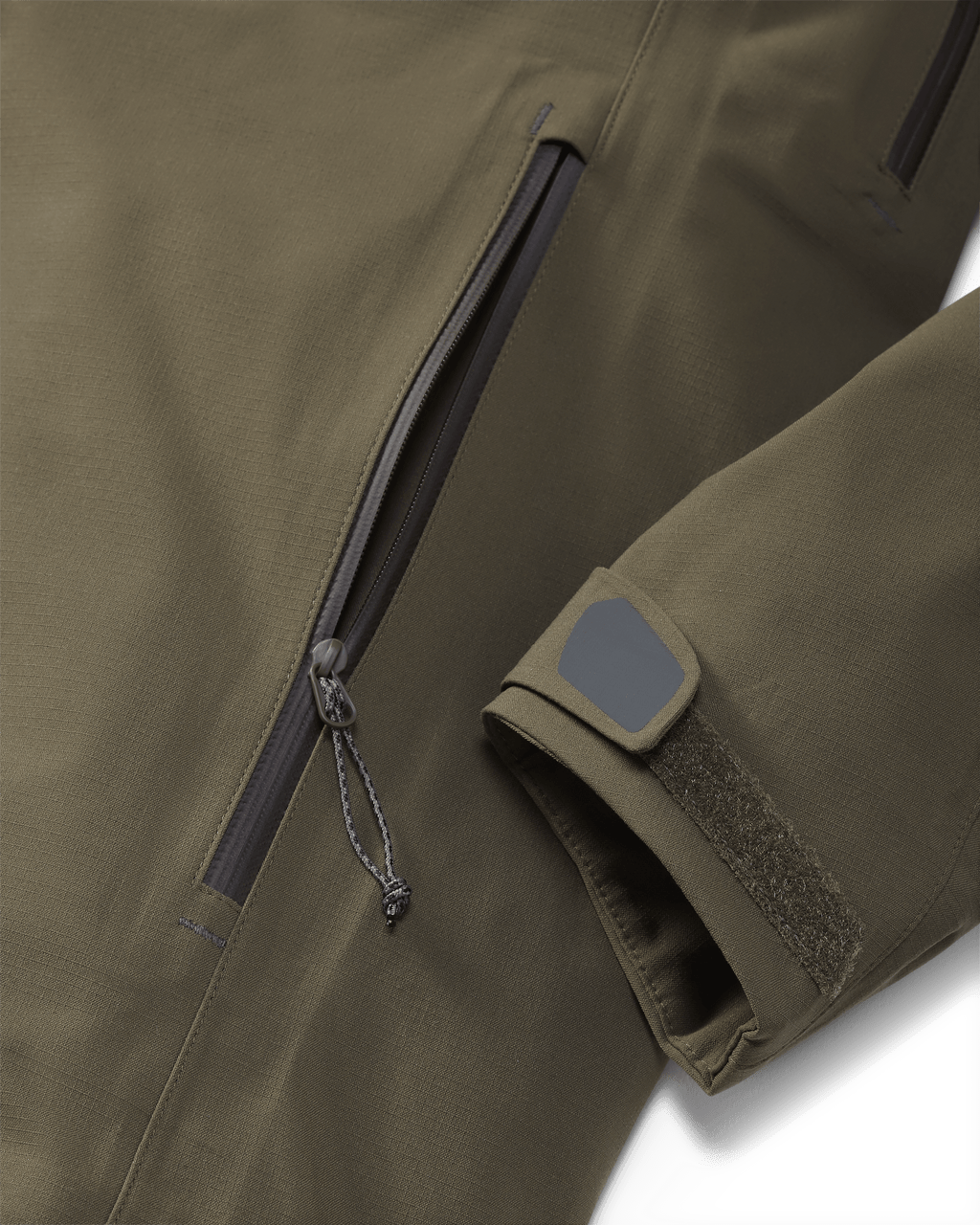 Kutana Storm Shell Jacket in Ash Brown, Highlighting wrist cuffs and hand pockets