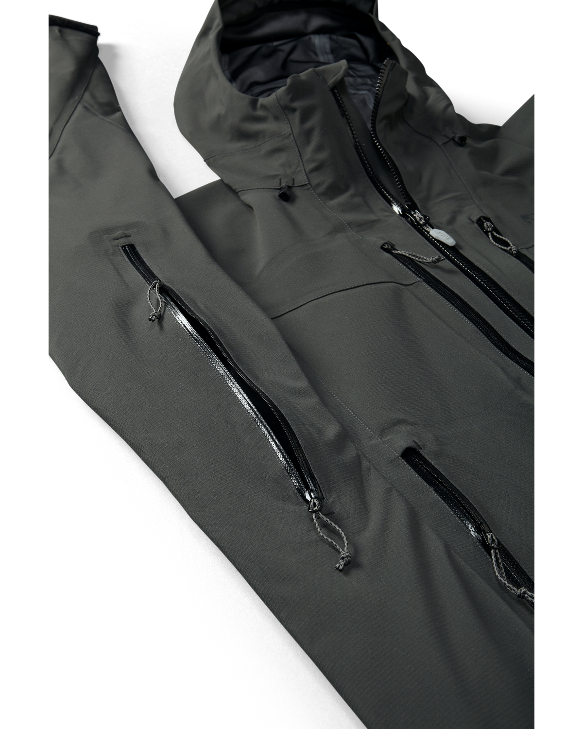 Kutana Storm Shell Jacket in Gunmetal Color showcasing pit zips and chest pocketing