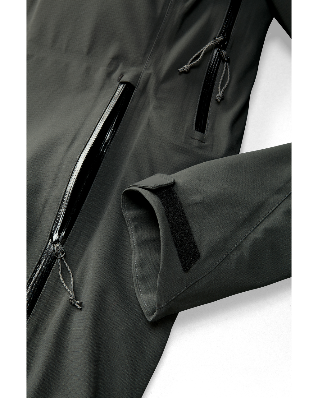 Kutana Storm Shell Jacket in Gunmetal Color showcasing wrist cuffs and hand pockets