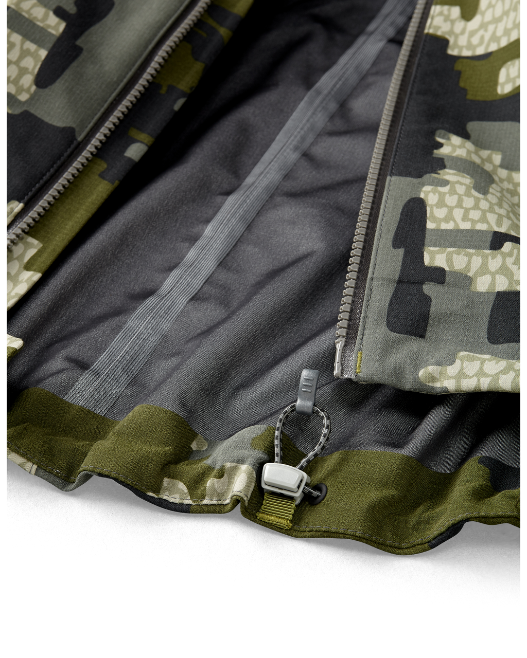 Kutana Storm Shell Jacket in Verde Camouflage Color showcasing the zipper and seam tape