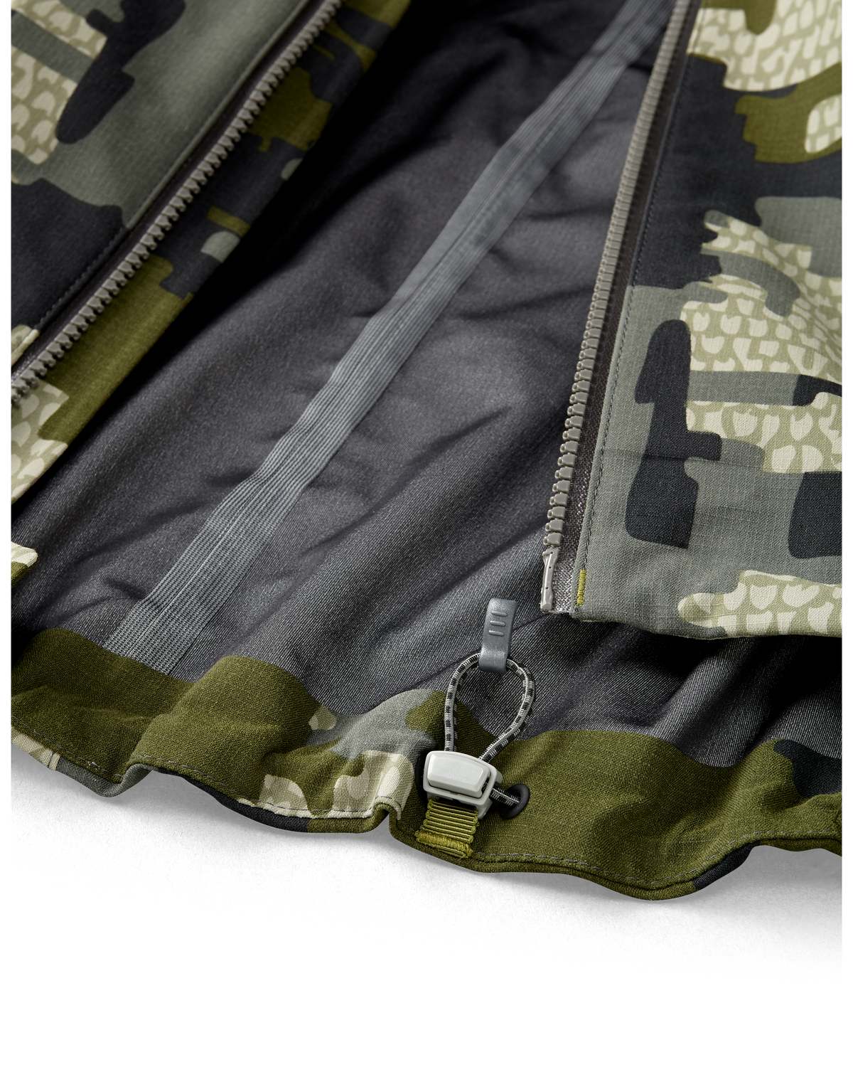 Kutana Storm Shell Jacket in Verde Camouflage Color showcasing the zipper and seam tape