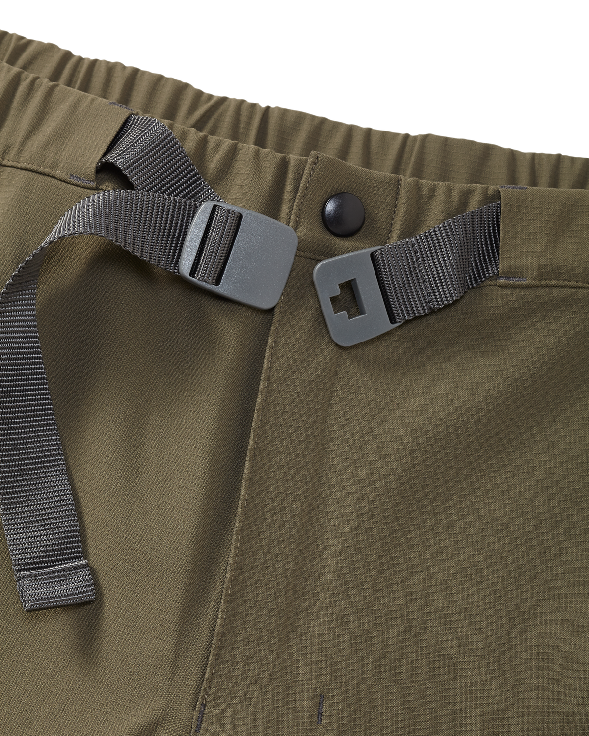 Zoomed in detail the Kutana Storm shell pant in Ash Brown color showcasing the built in belt