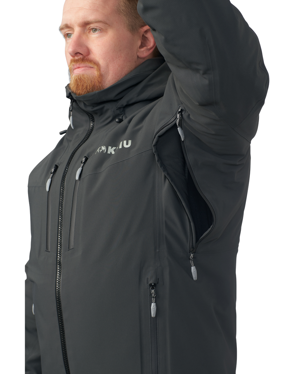 Hunter wearing the Kutana Gale Force Hooded Jacket in Gunmetal with their arm up showcasing the pit zip
