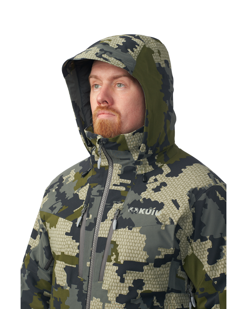 Hunter wearing helmet and hood on the Kutana Gale Force Hooded Jacket in Verde Camouflage