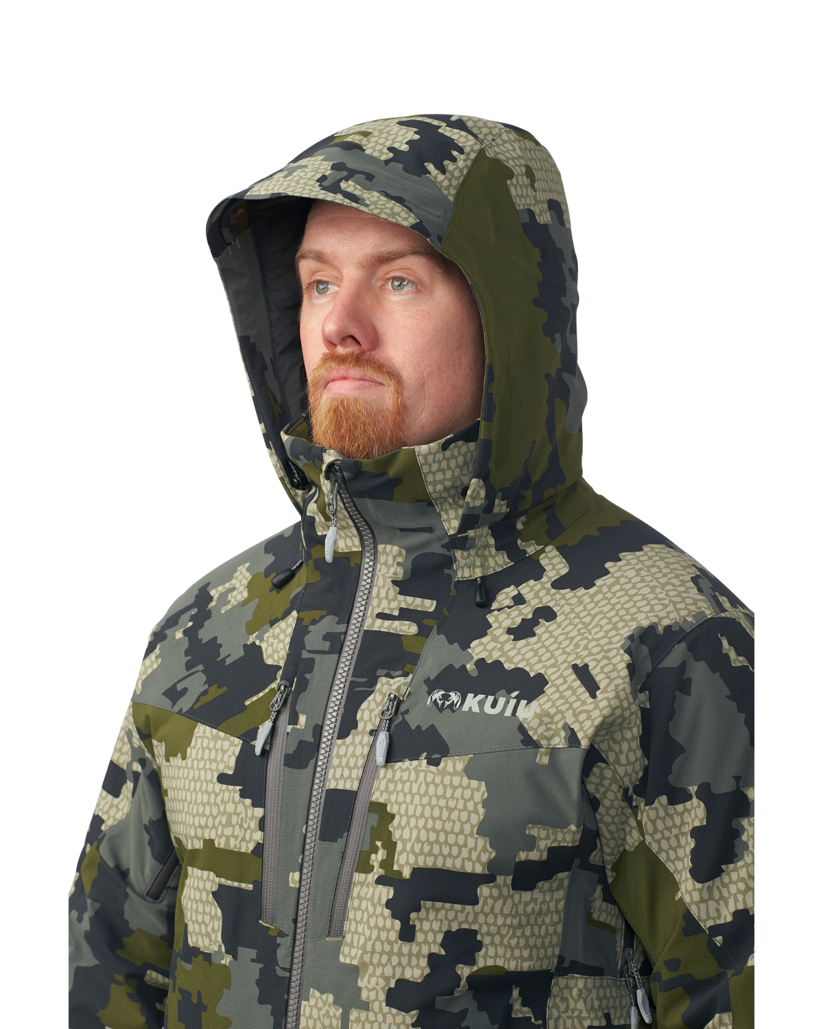 Hunter wearing helmet and hood on the Kutana Gale Force Hooded Jacket in Verde Camouflage