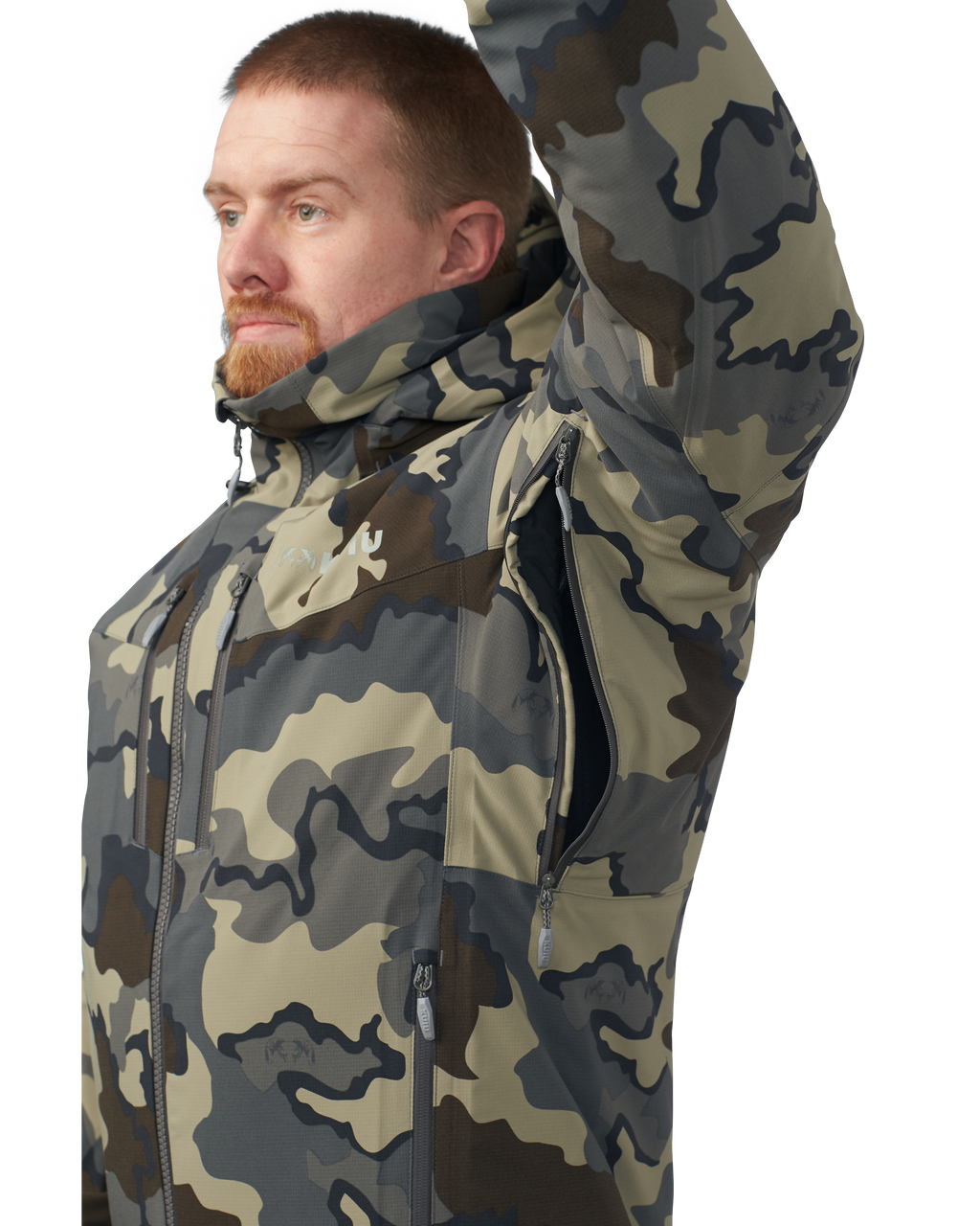 Hunter wearing the Kutana Gale Force Hooded Jacket in Vias Camouflage with their arm up showcasing the pit zip