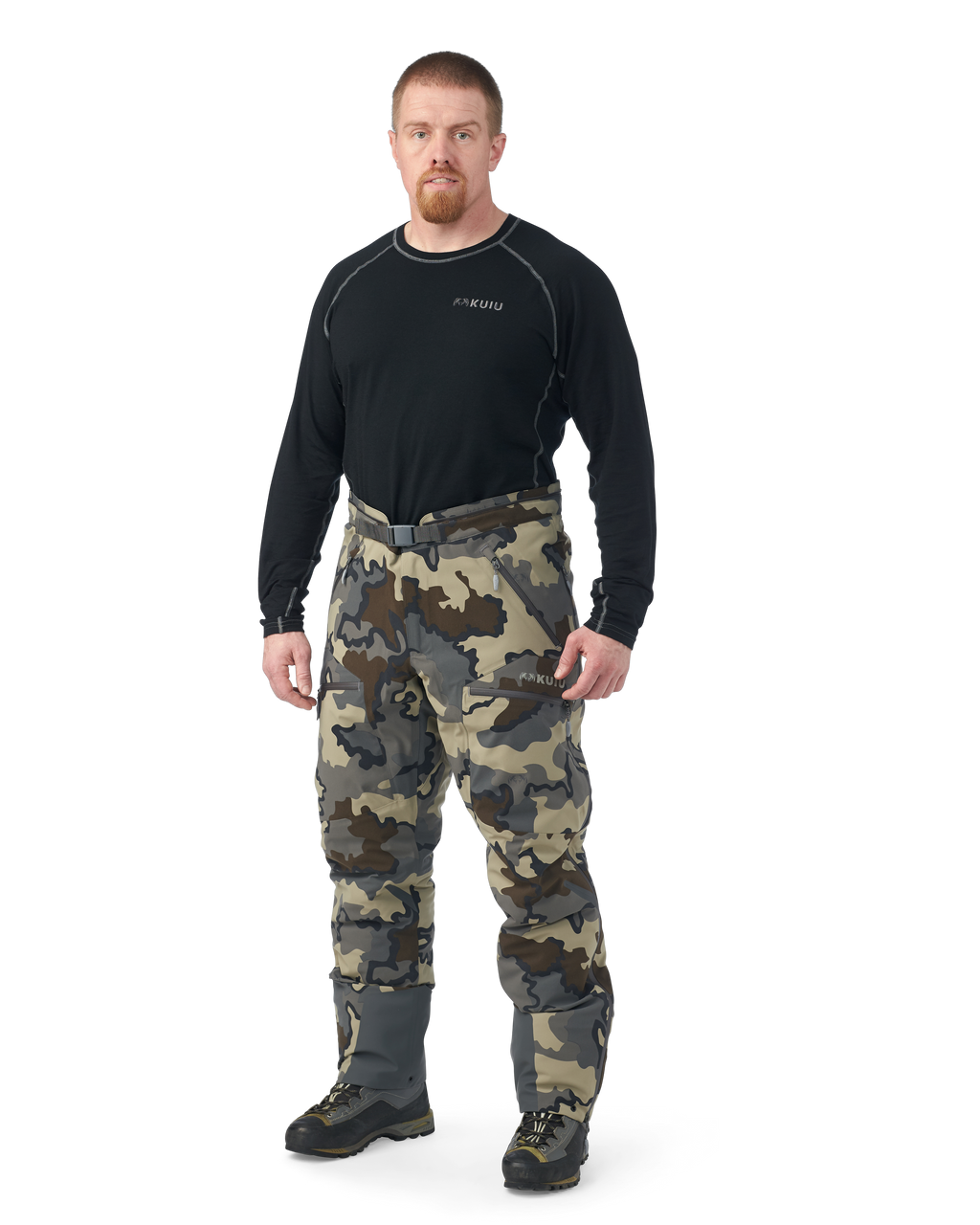 Hunter wearing Kutana Gale Force Pant in Vias Camouflage without suspenders over shoulders