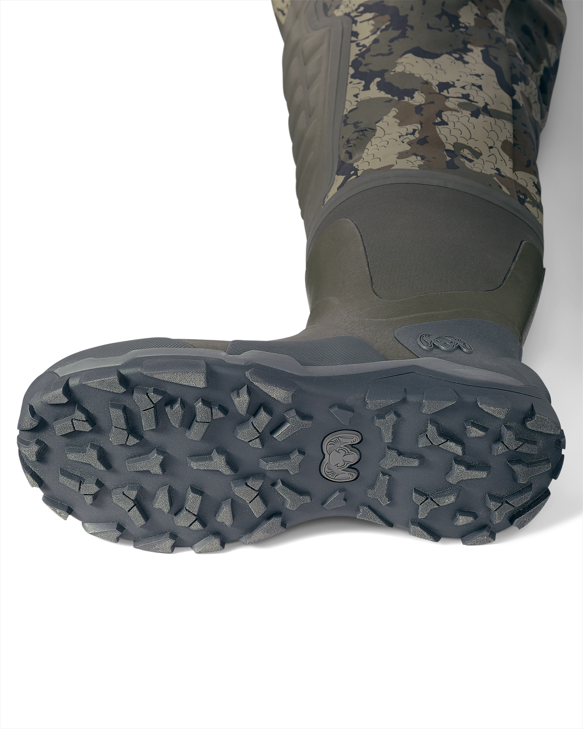 Bottom of KUIU PRO HD Flex Zip Wader Boots in Veros camouflage Highlighting the Self-cleaning Soles