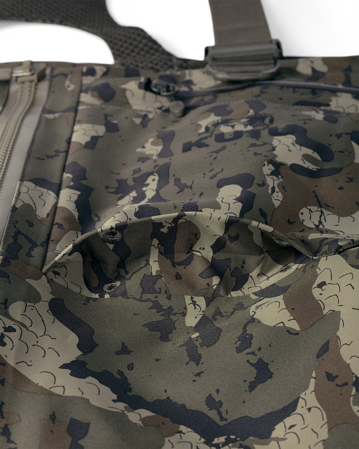 Detail of billowed chest pocket with drain holes and secure flap closure on KUIU PRO HD Flex Zip Wader in Veros Camouflage