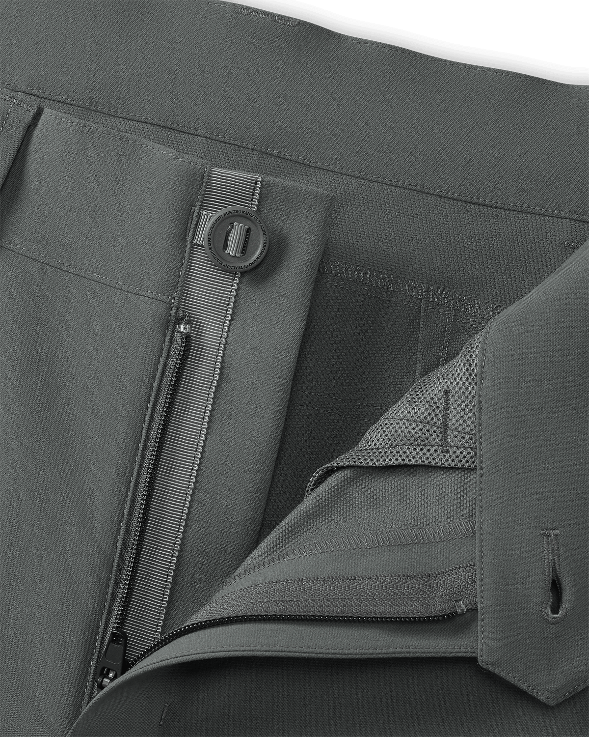 Detailed of open fly front zipper and button on KUIU Kutana Stretch Woven Pant in Stone Grey