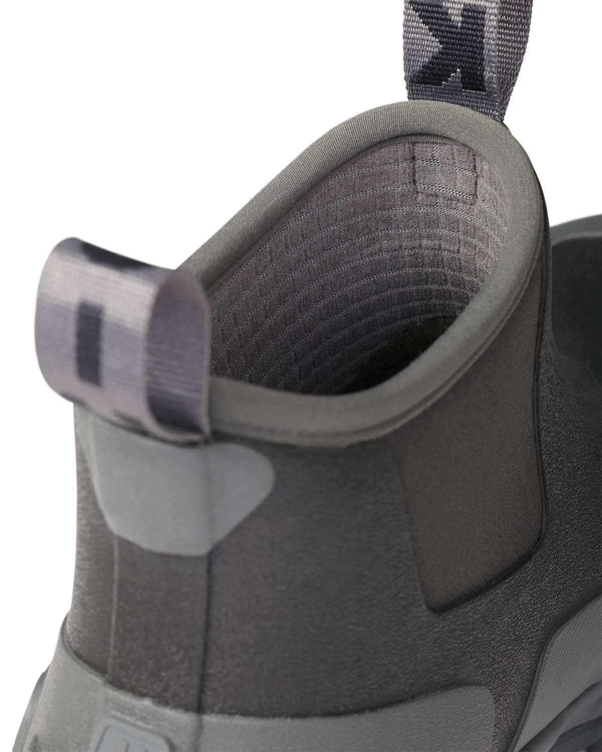 Close-up of pull-on loops and highlighting the grid fleece liner on the KUIU Ankle Mud Boot in Asphalt Grey