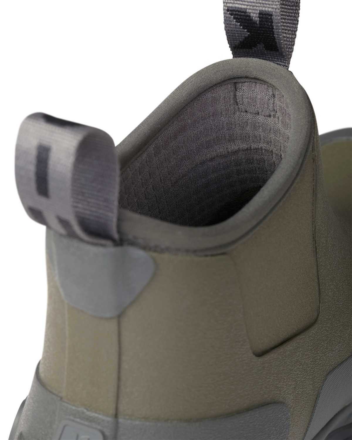 Close-up of pull-on loops and highlighting the grid fleece liner on the KUIU Ankle Mud Boot in Ash Brown