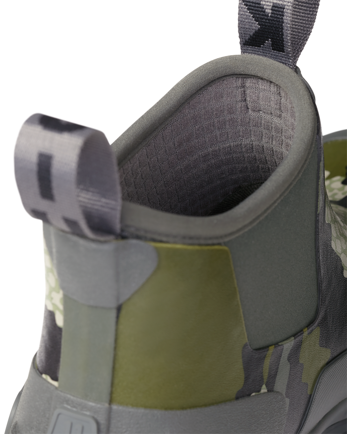 Close-up of pull-on loops and highlighting the grid fleece liner on the KUIU Ankle Mud Boot in Verde Camouflage