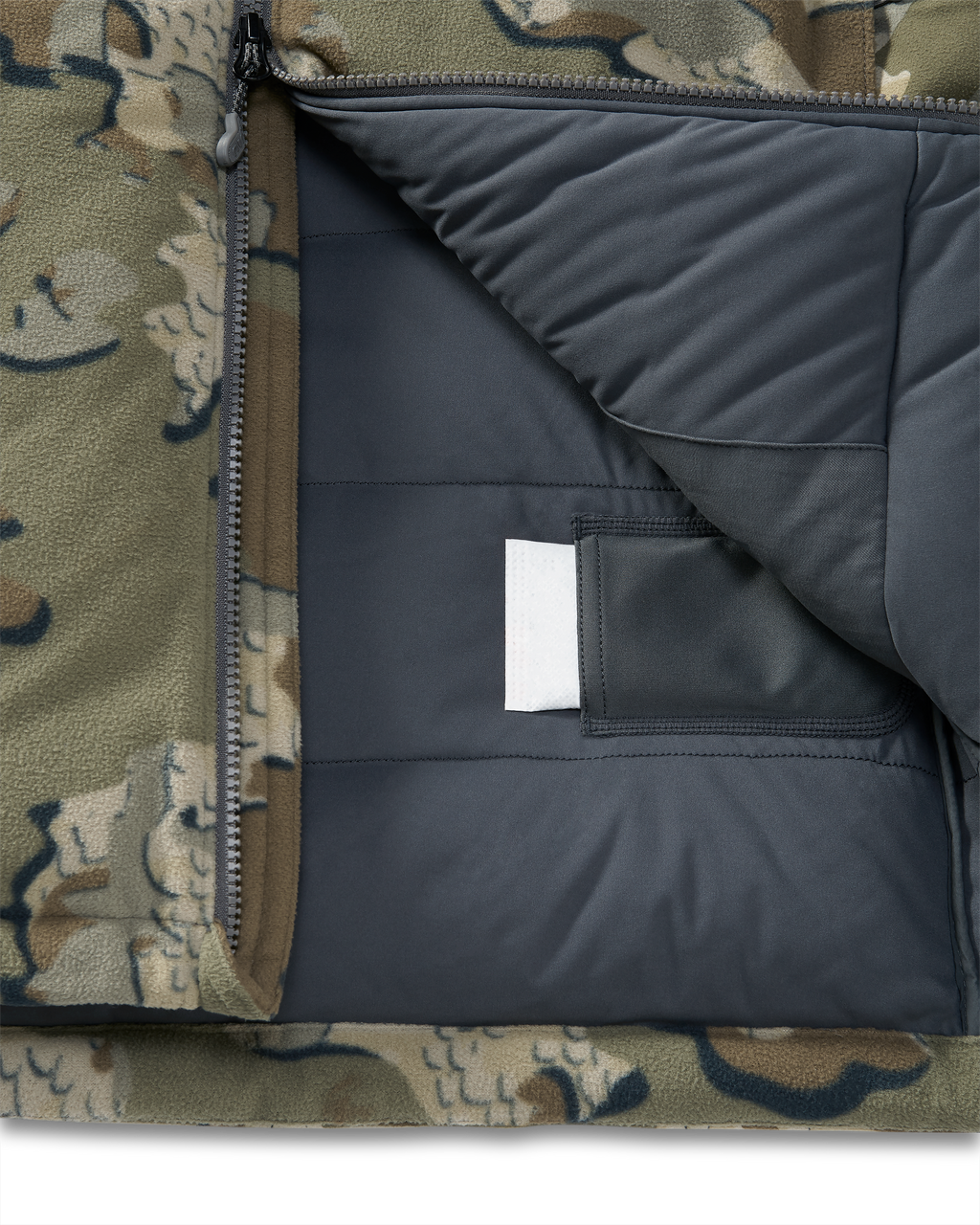 Internal heat pack pockets on the Super Down Haven Hooded Jacket in Valo Camouflage