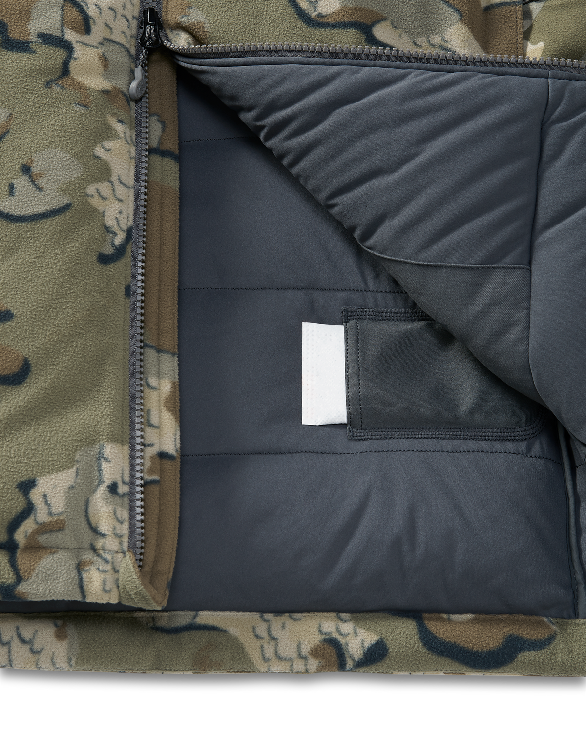 Internal heat pack pockets on the Super Down Haven Hooded Jacket in Valo Camouflage