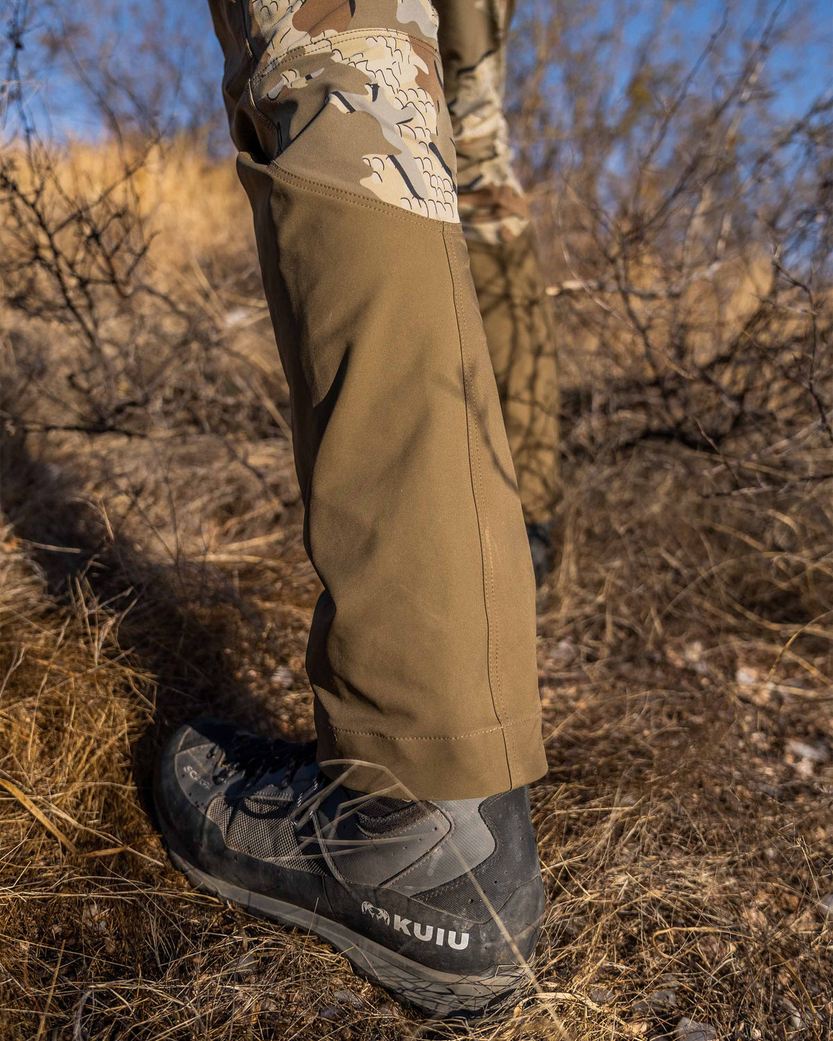 Detail back of leg with engaged boot hook on hunter wearing PRO Brush Pant in Valo Camouflage