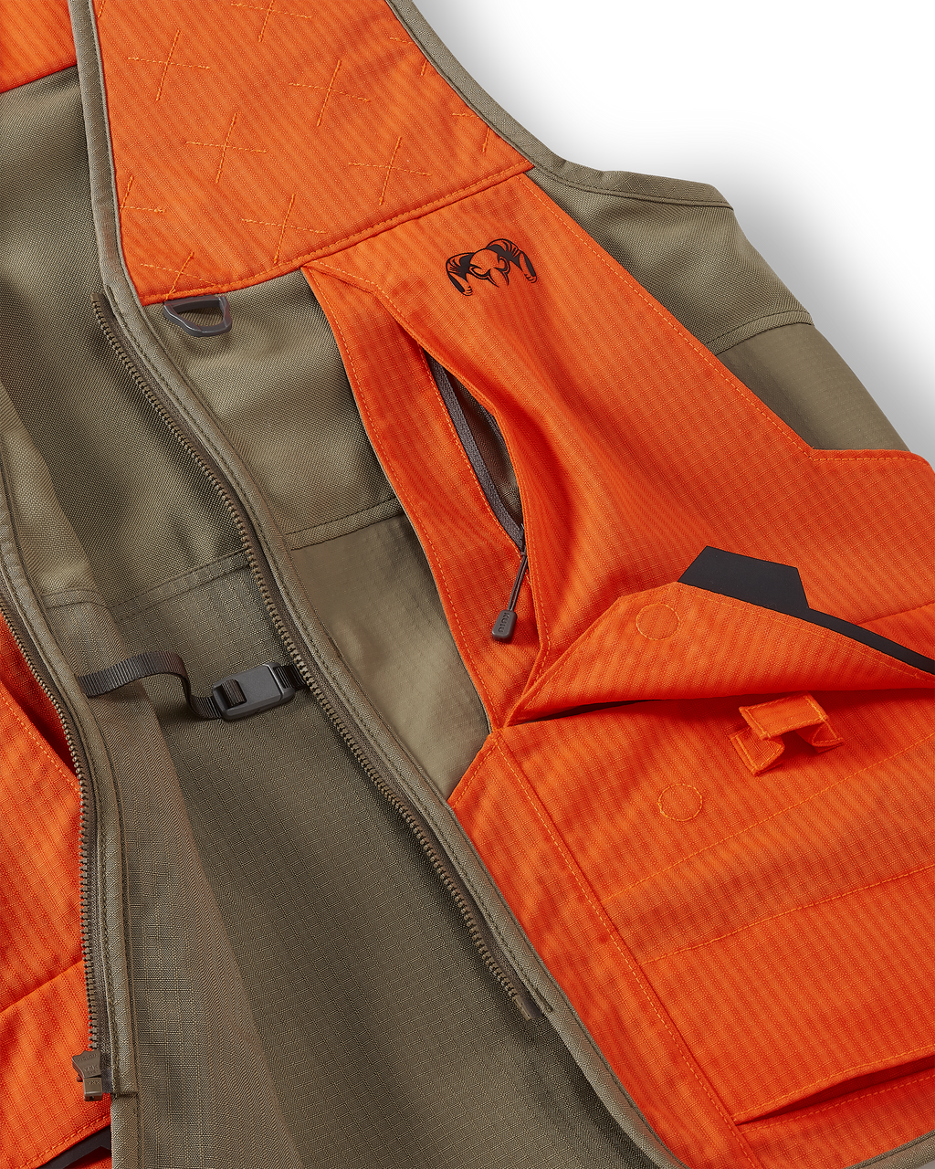Close-up of front cargo pockets with magnetic snap-down flaps and easy-grab loops on the Core Upland Vest in Khaki/Blaze Orange
