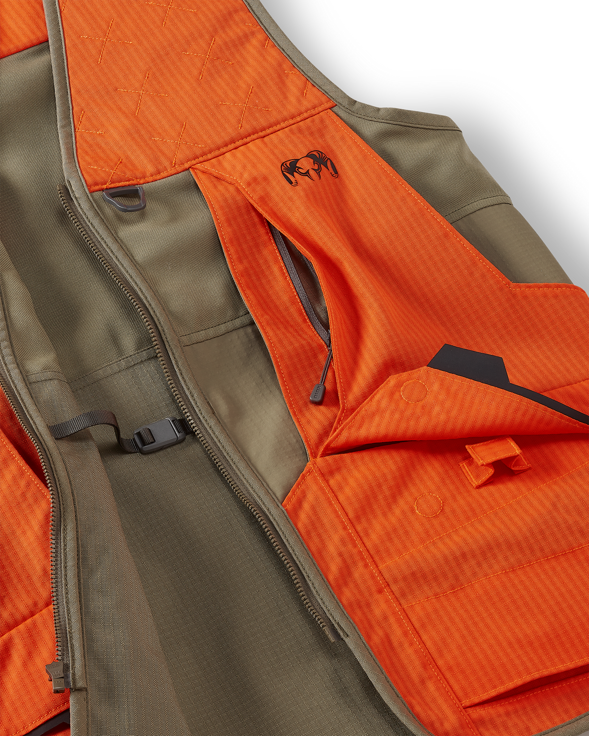 Close-up of front cargo pockets with magnetic snap-down flaps and easy-grab loops on the Core Upland Vest in Khaki/Blaze Orange