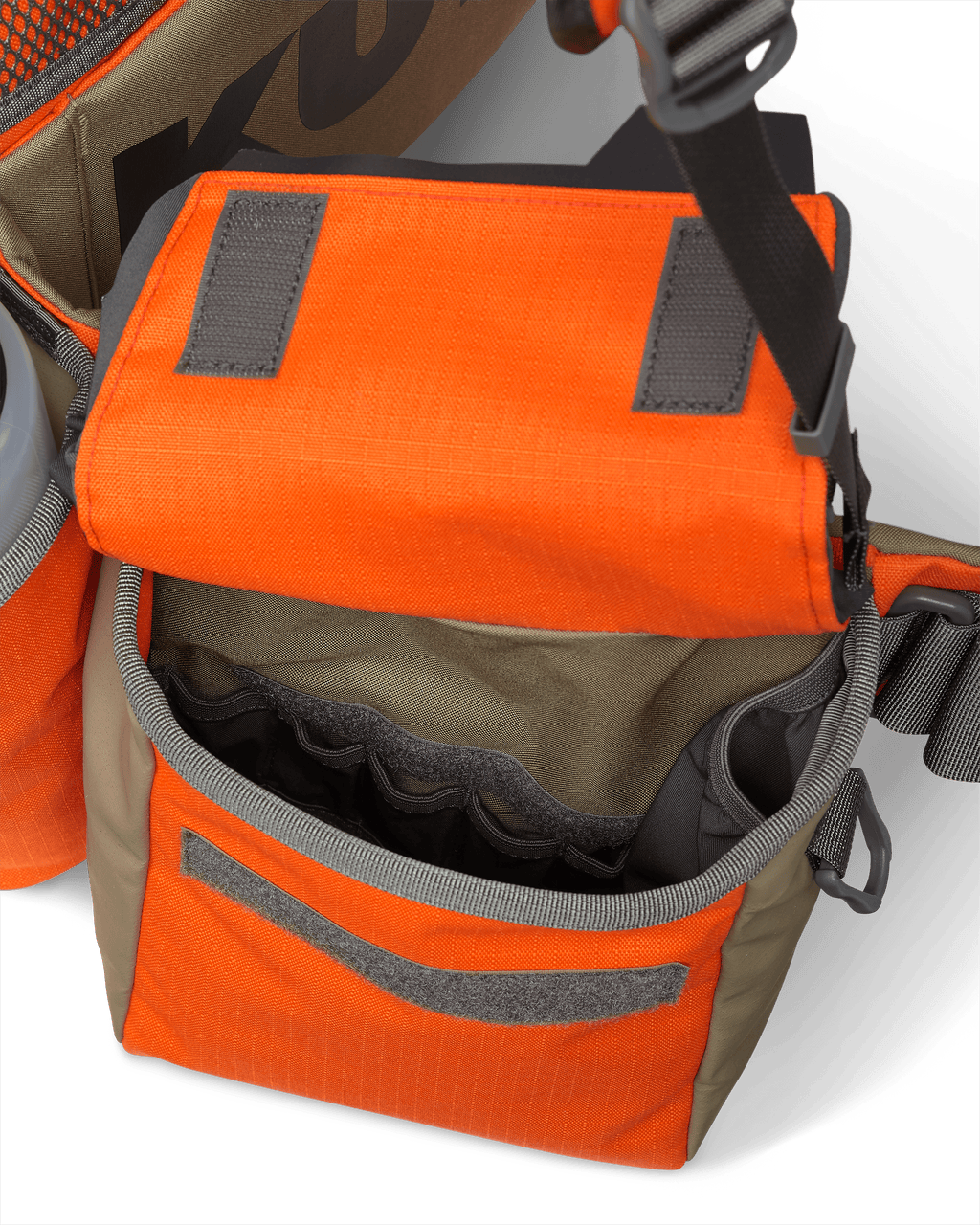 Inside view of deep hip pouch on the Upland Field Vest in Blaze Orange