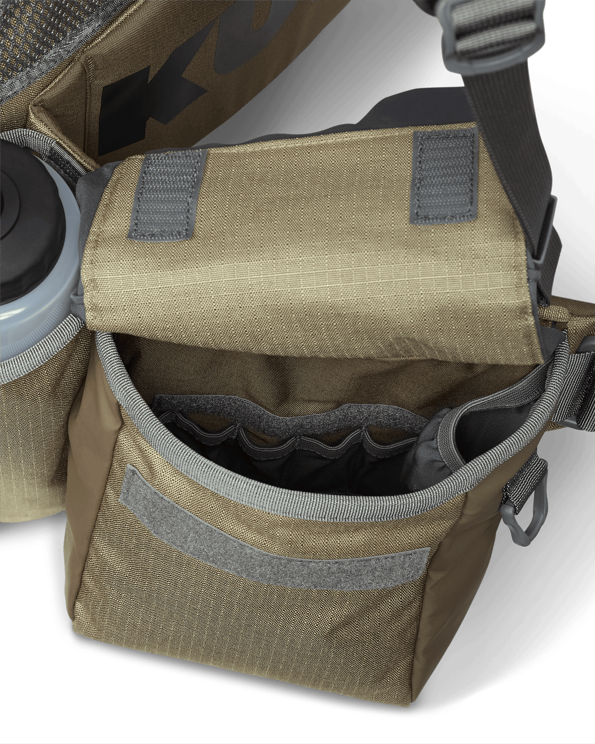 Inside view of deep hip pouch on the Upland Field Vest in Khaki