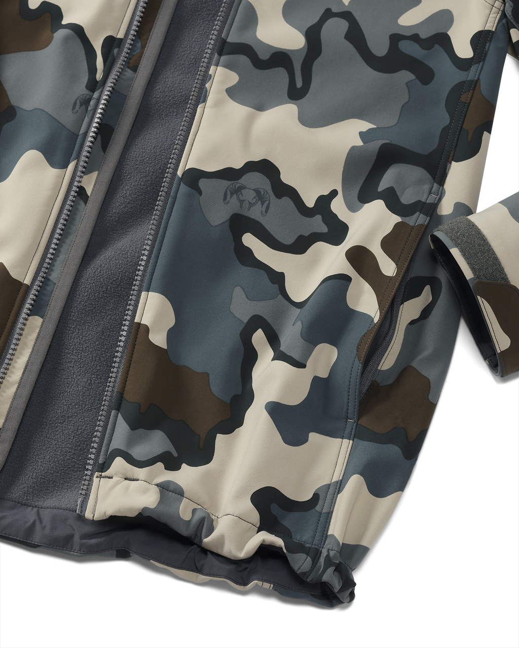 Detail showing hand pocket and adjustable velcro cuff on Youth Trail Blazer Jacket in Vias Camouflage