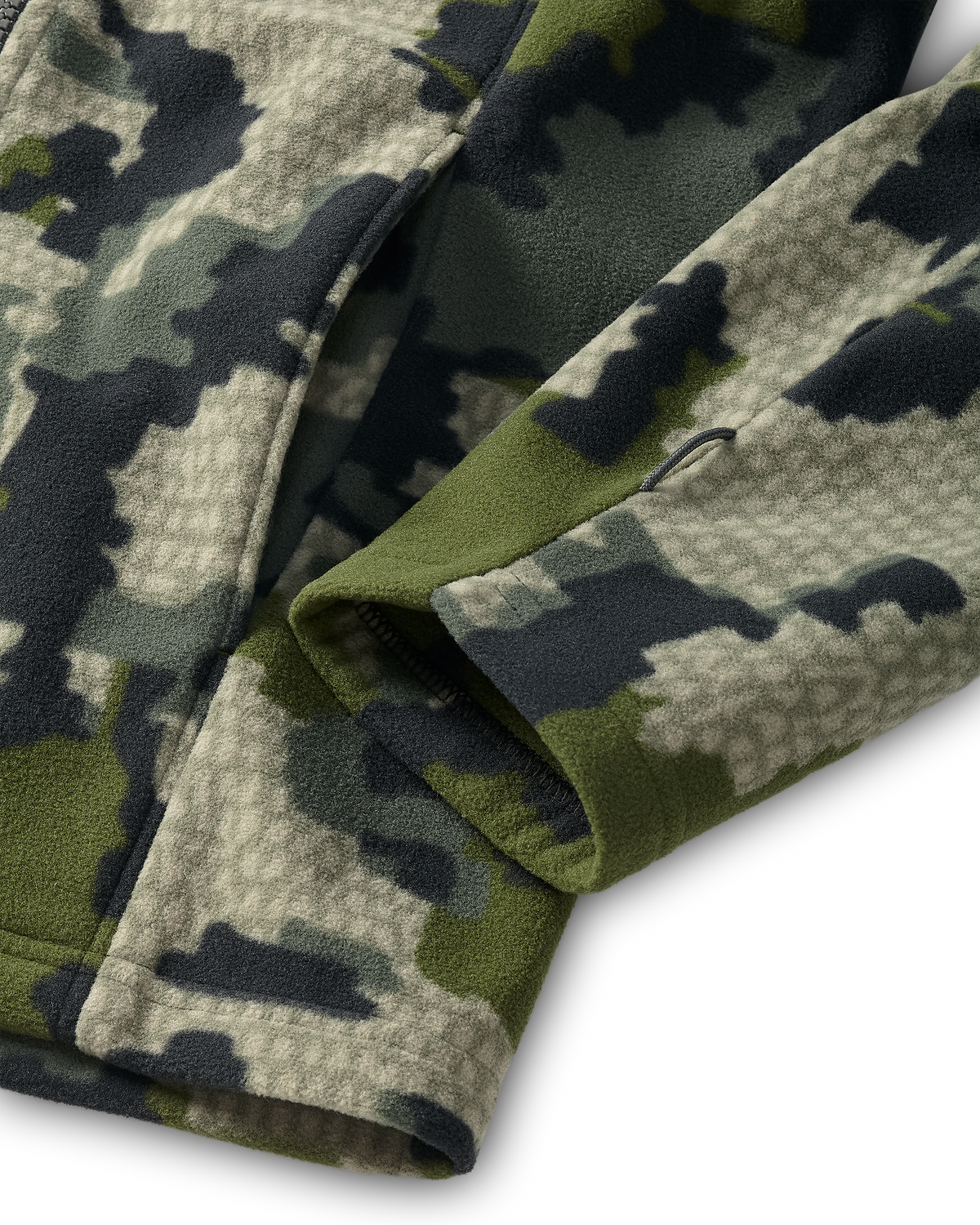 Close-up of the hand pocket and sewn utility loop on the bottom sleeve of a Youth Versa Fleece Full Zip in Verde Camouflage.
