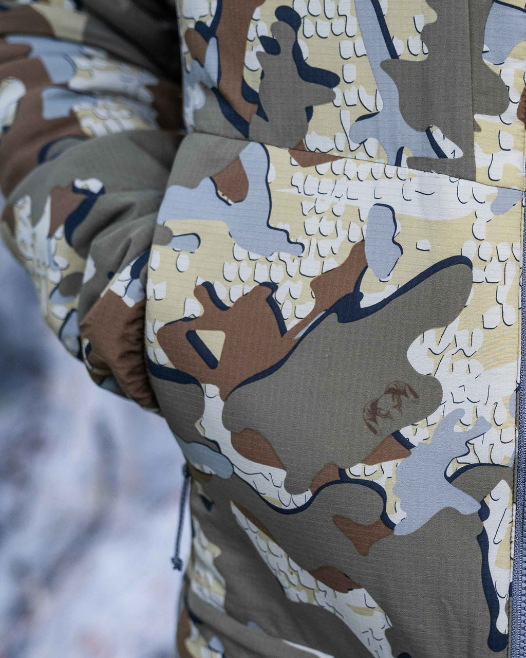 Zoomed in detail hand pocket on the Kenai Jacket in Valo Camouflage