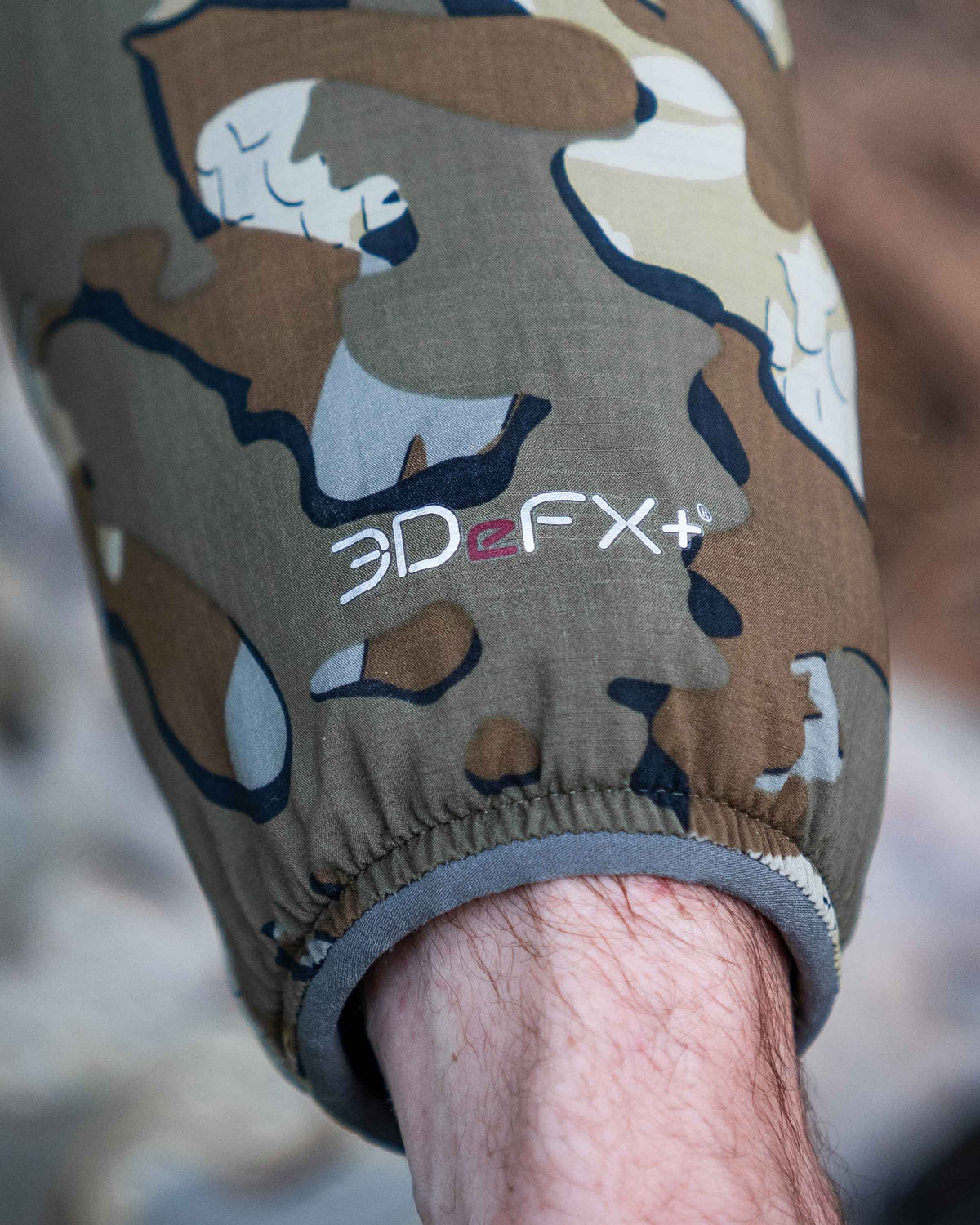 Zoomed in detail wrist cuff and 3DeFX+ logo on the Kenai Jacket in Valo Camouflage