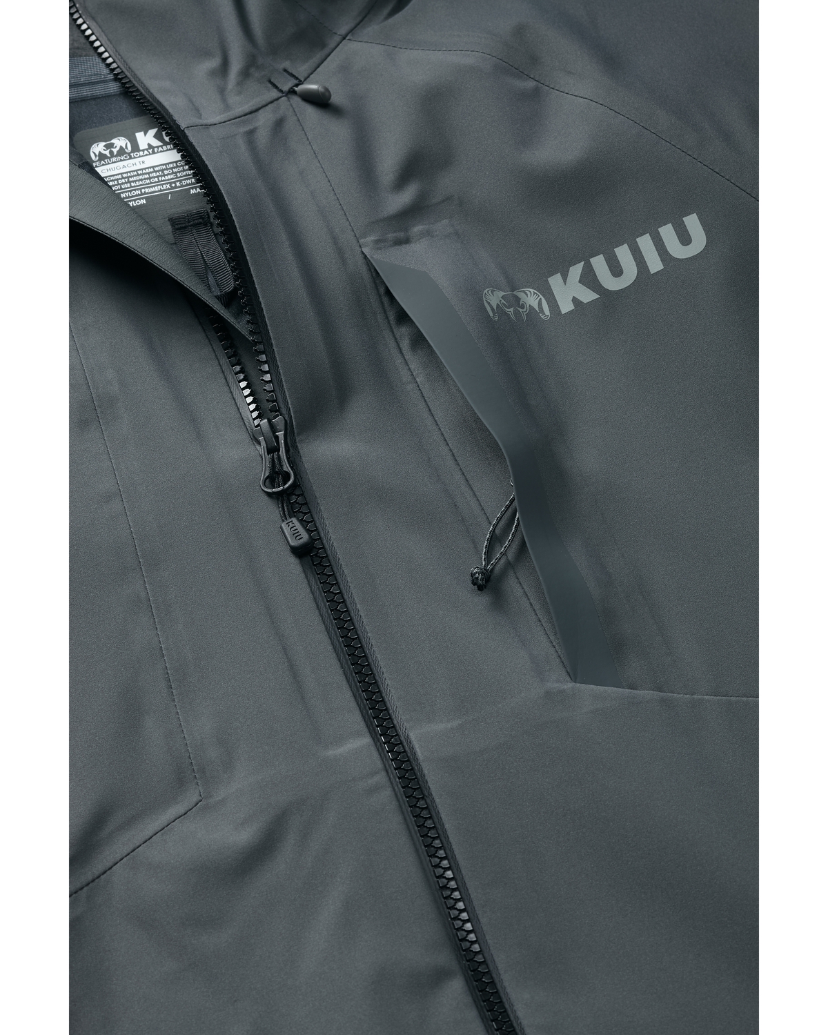 Detail of partially open zippered chest pocket on Chugach TR Rain Jacket in Gunmetal Grey