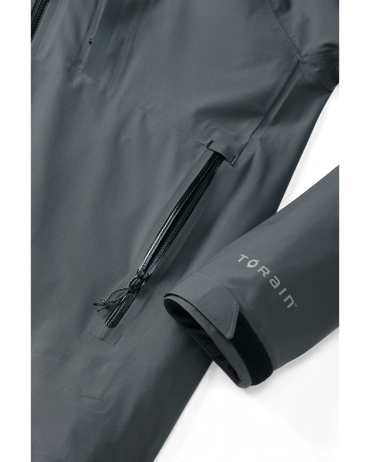 Detail of open zippered hand pocket and cuff on Chugach TR Rain Jacket in Gunmetal Grey