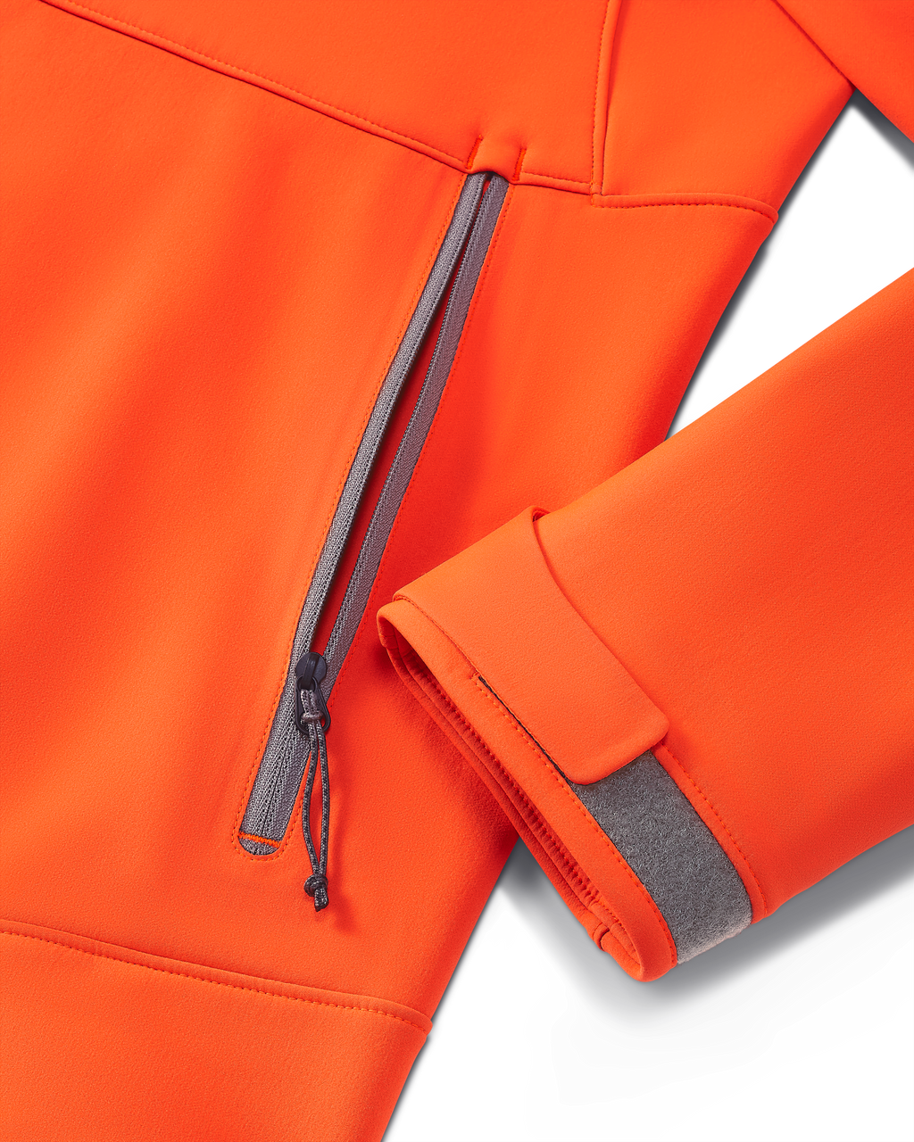 Front of Guide PRO Hooded Jacket in Blaze Orange, Highlighting YKK Zippered Hand Pocket and Adjustable Hoop and Loop Cuff Closure