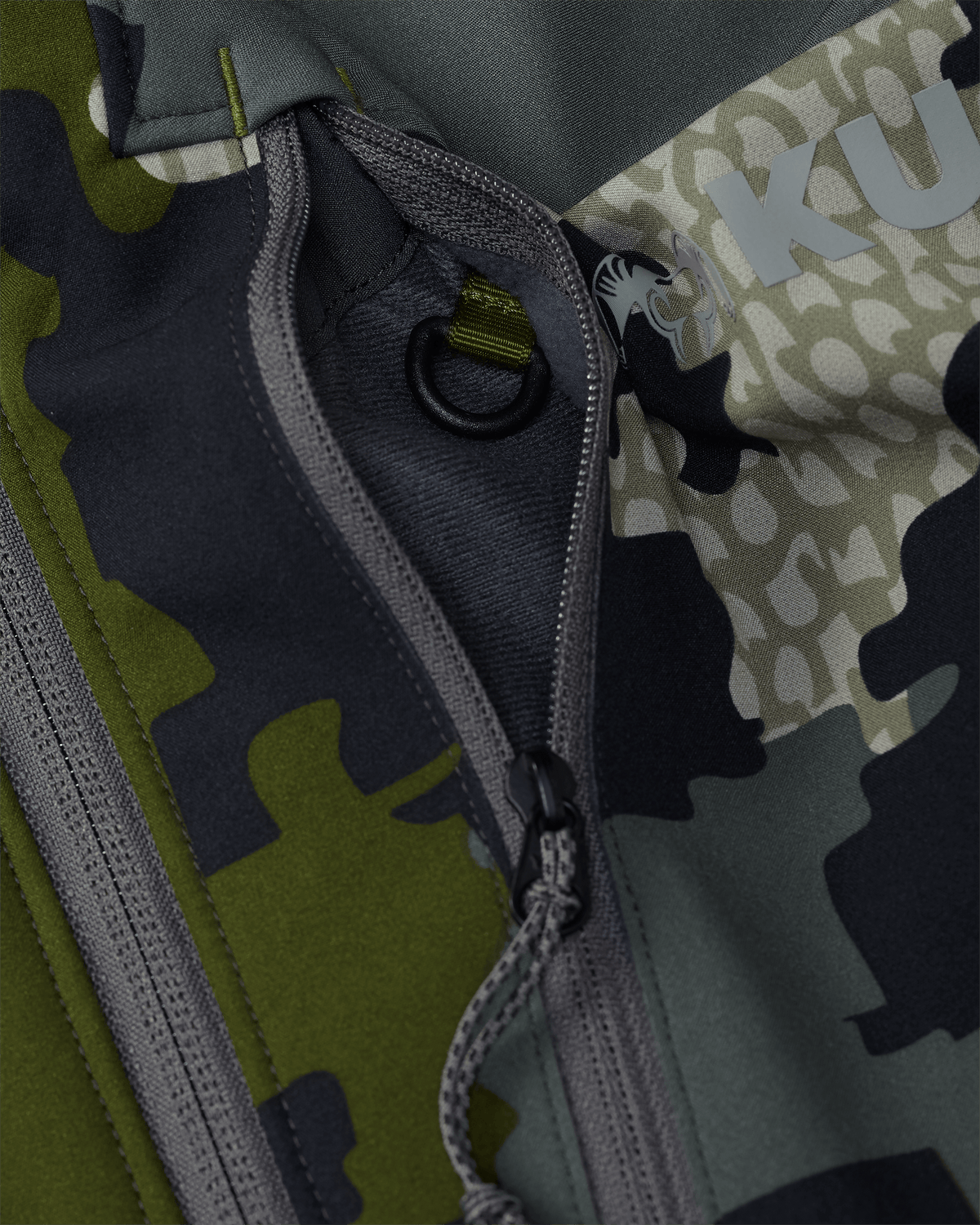 Front of Guide Pro Hooded Jacket in Verde Camouflage Highlighting YKK Zippered Chest Pocket and Interior Accessory Attachment D Ring