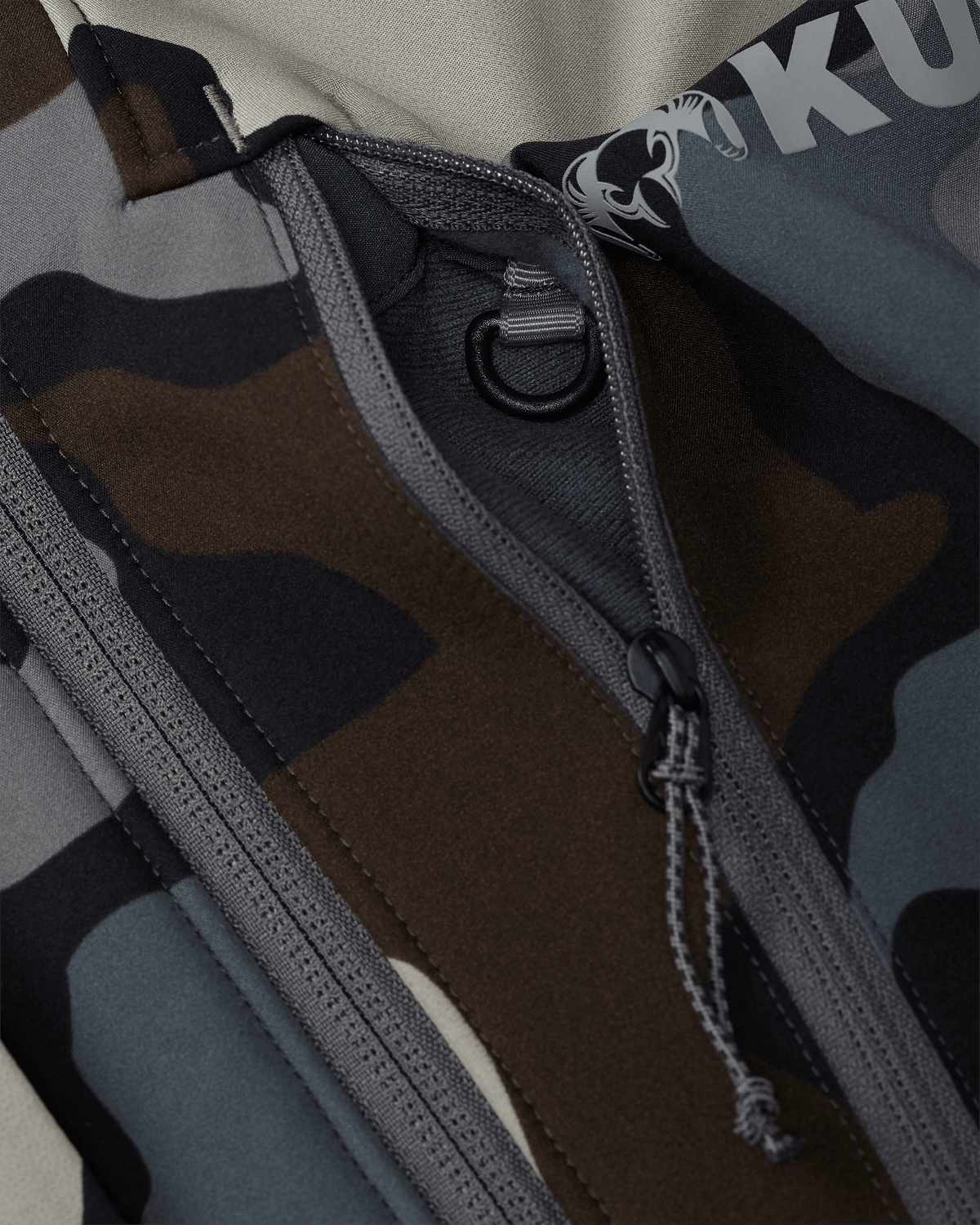 Front of Guide Pro Hooded Jacket in Vias Camouflage Highlighting YKK Zippered Chest Pocket and Interior Accessory Attachment D Ring