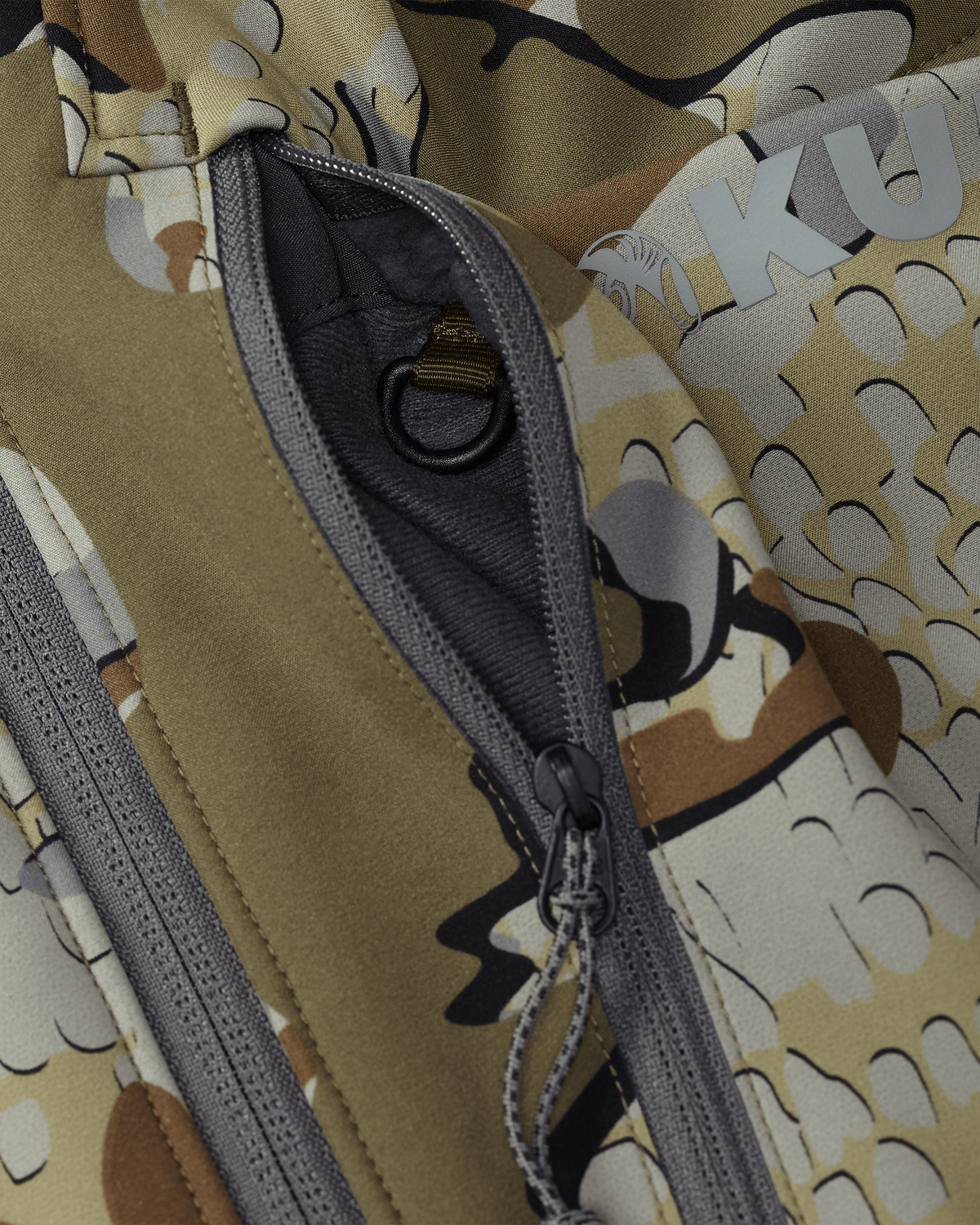 Front of Guide Pro Hooded Jacket in Valo Camouflage Highlighting YKK Zippered Chest Pocket and Interior Accessory Attachment D Ring