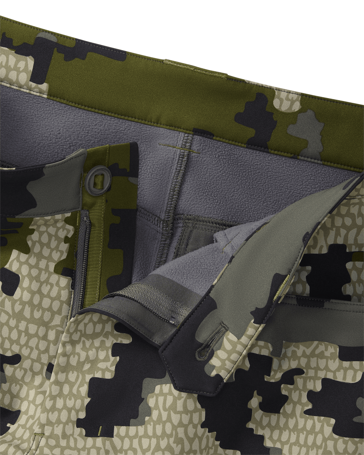 Detailed view of unbottoned Guide PRO Pant in Verde camouflage with fabric folded to show interior of waist band and fleece lining