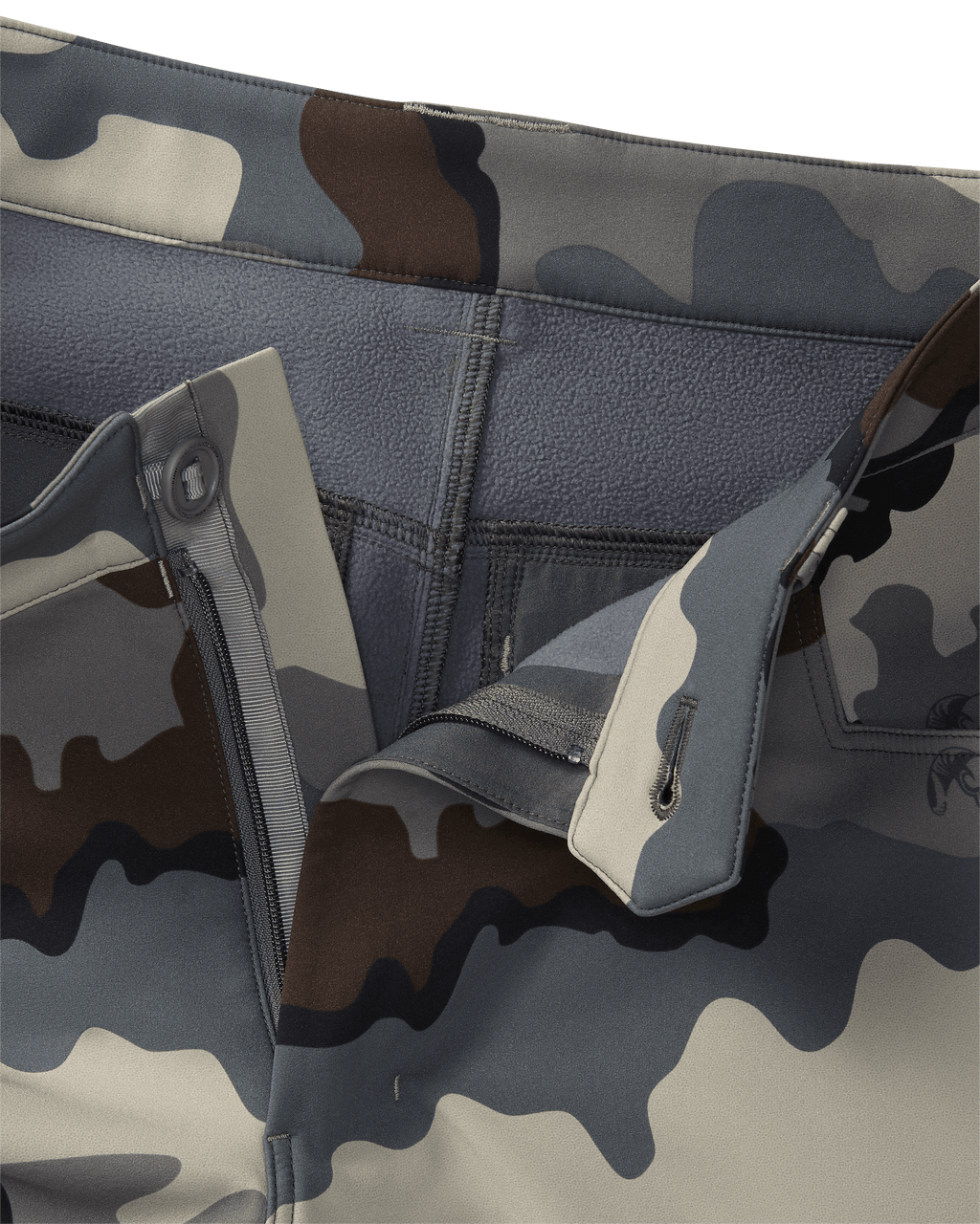Detailed view of unbottoned Guide PRO Pant in Vias camouflage with fabric folded to show interior of waist band and fleece lining