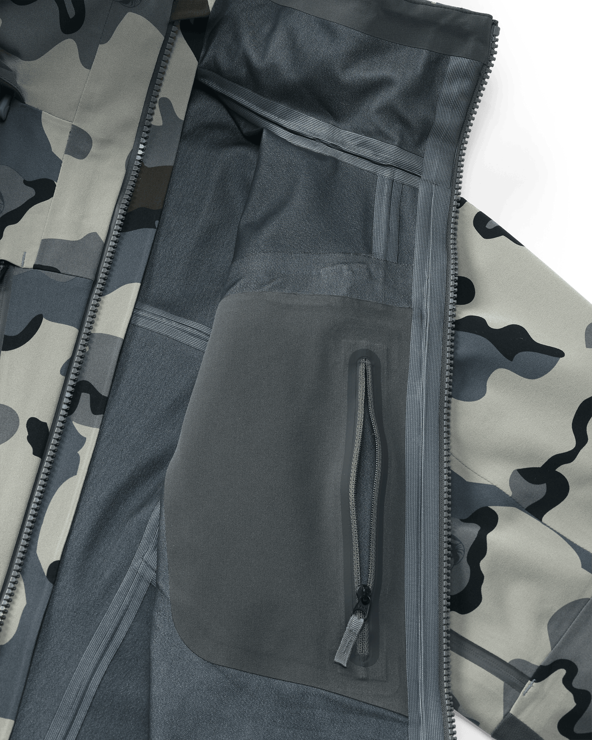 Interior view of Yukon TR Rain Jacket in Vias Camouflage showing internal zippered chest pocket and seam tape