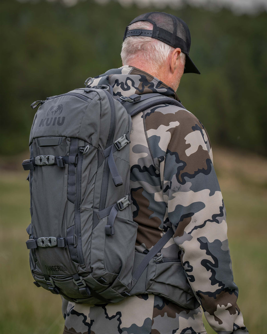 Back angle view of hunter carrying Ranger 2200 in Gunmetal Grey
