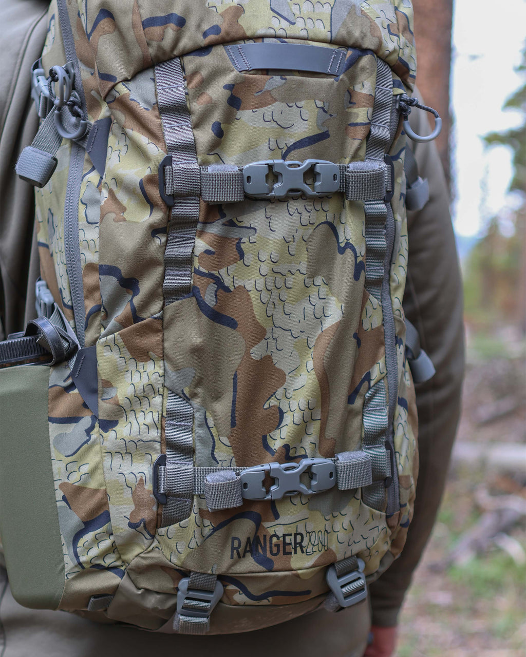 Close-up view of front compression straps  and daisy chain webbing on the Ranger 2200 in Valo Camouflage