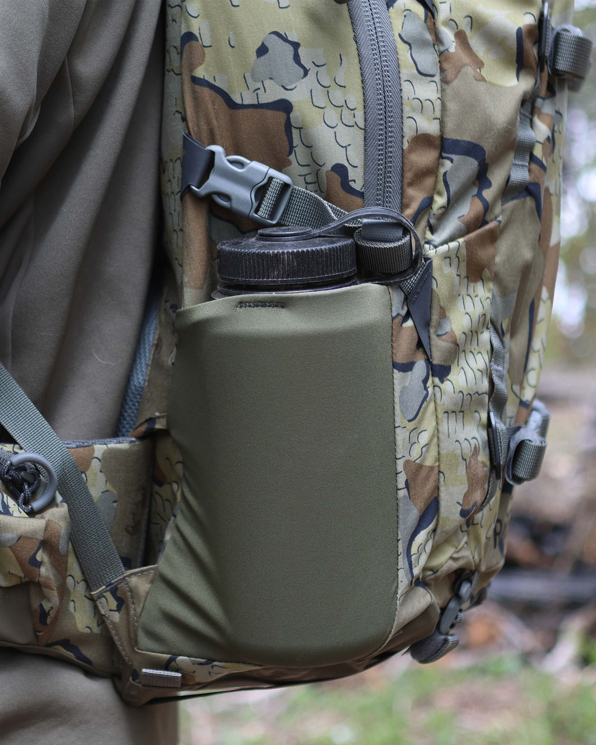 Close-up of a side pocket, sized to hold up to a 3-liter water bottle container on the Ranger 2200 in Valo Camouflage