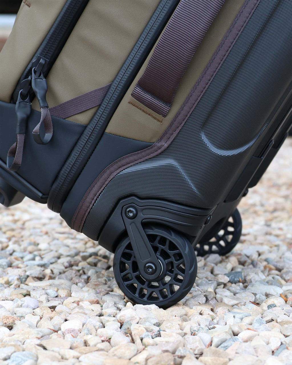 Close-up of the 3.5 inch wheels on the Waypoint 3000 Roller Travel Bag in Bourbon Brown