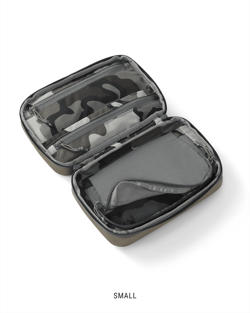 Clear view of the interior storage of a small Waypoint Dopp Kit in Bourbon Brown