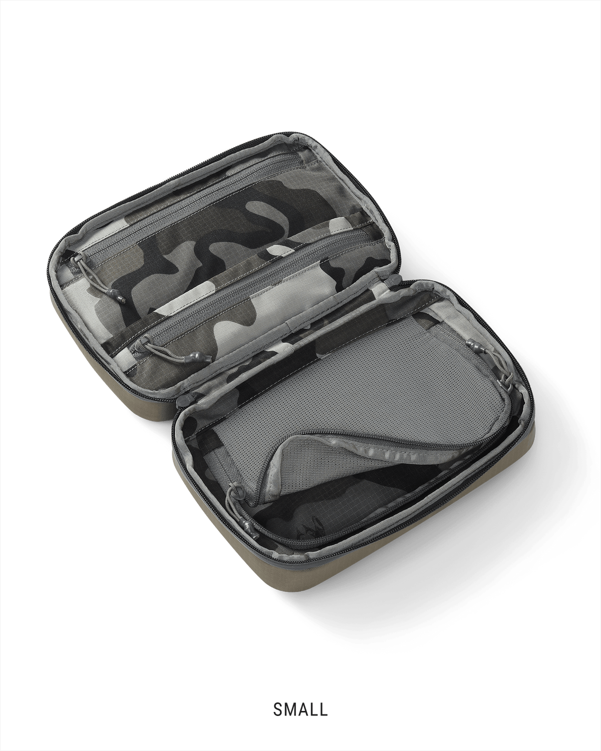 Clear view of the interior storage of a small Waypoint Dopp Kit in Bourbon Brown