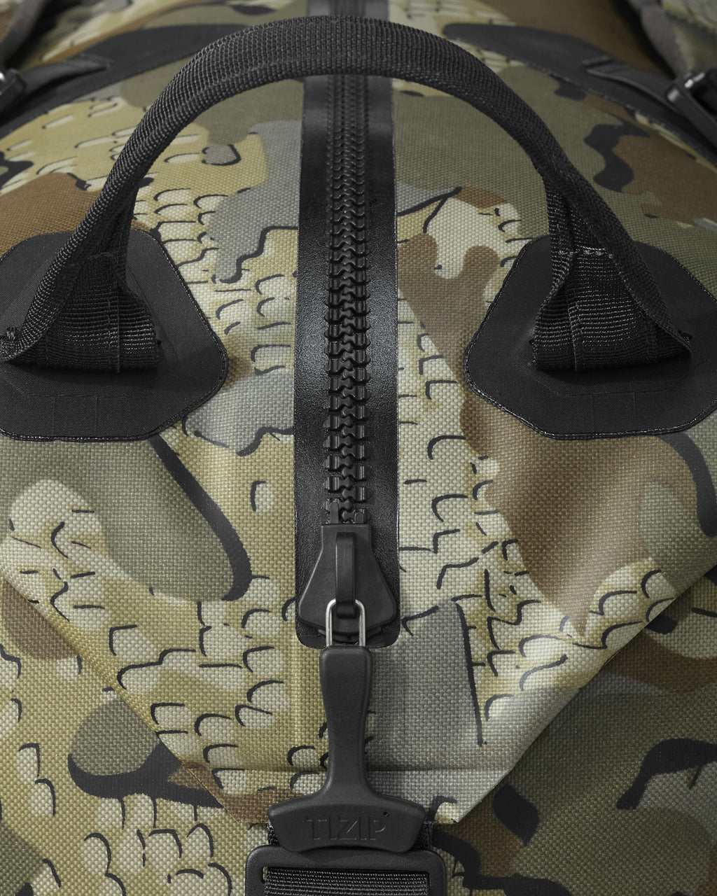 Side of Kodiak 6600 Submersible Duffel in Valo Camouflage Highlighting TIZIP® Masterseal Watertight and Airtight Zippers