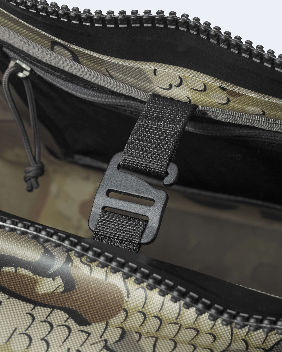 Close Top Profile of Kodiak 6600 Submersible Duffel in Valo Camouflage Highlighting Internal Storage Support Hook