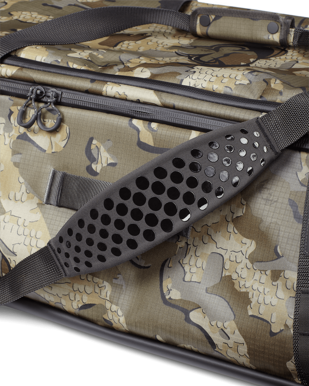 Close-up of non-slip, silicone dot matrix grip, padded shoulder strap on KUIU Two Track Duffel Bag in Valo Camouflage