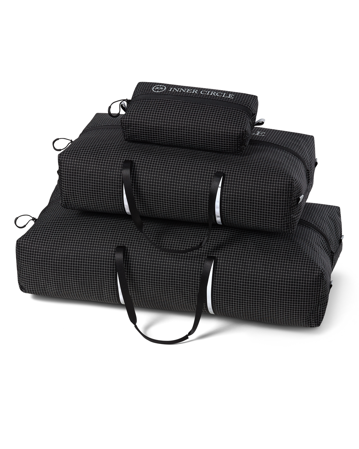 Three nested Inner Circle Extrema Bag Set with a fine checkered pattern, featuring white handles and zippers. The top bag shows the brand name 'INNER CIRCLE'.