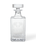 Front of KUIU Engraved Decanter in Clear glass, featuring an etched ram head logo and KUIU text.